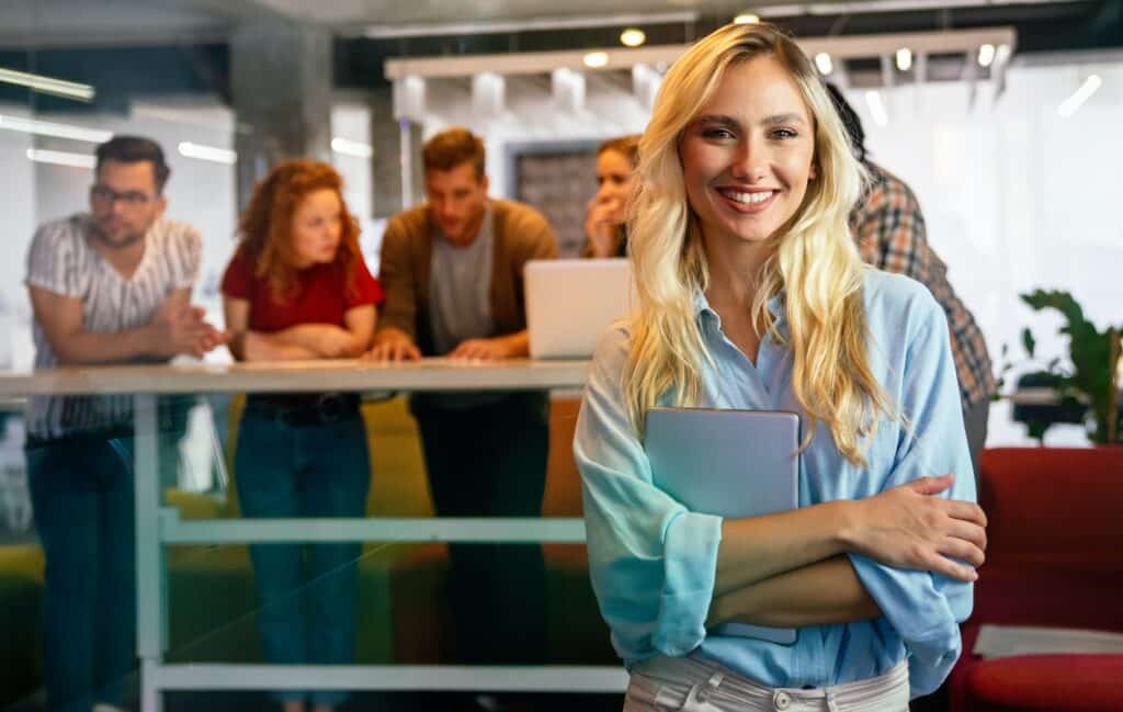 Group of happy business people working together on project in office